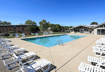 Sparkling outdoor heated swimming pool with expansive sundeck